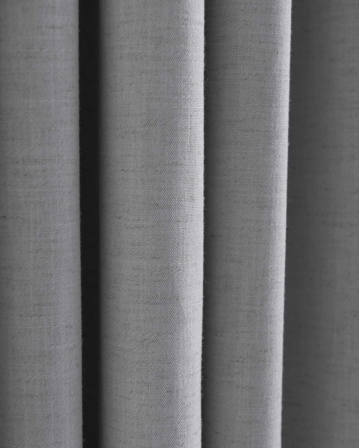 Detailed close-up of soft gray Sally Linen Blend fabric, showcasing natural texture and gentle drape for custom drapery.