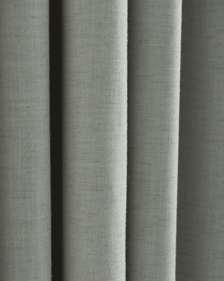 Close-up of folded Sally Linen Blend fabric swatch, showcasing its natural texture for custom drapery.