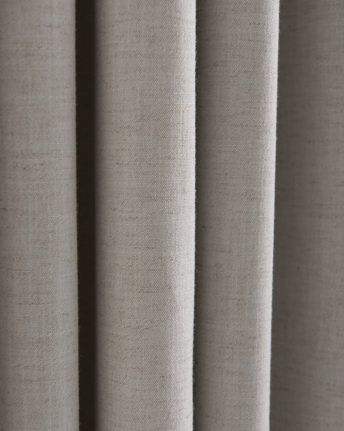 Close-up of Sally linen blend fabric swatch in light beige, highlighting its rich, natural texture & sophisticated drape for custom window treatments.