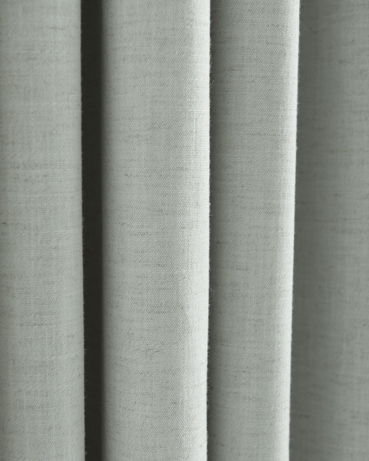Close-up of Sally linen blend fabric, showcasing its natural subtle texture and flowing drape, ideal for custom window treatments.