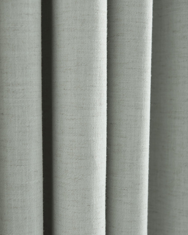 Close-up of Sally linen blend fabric, showcasing its natural subtle texture and flowing drape, ideal for custom window treatments.