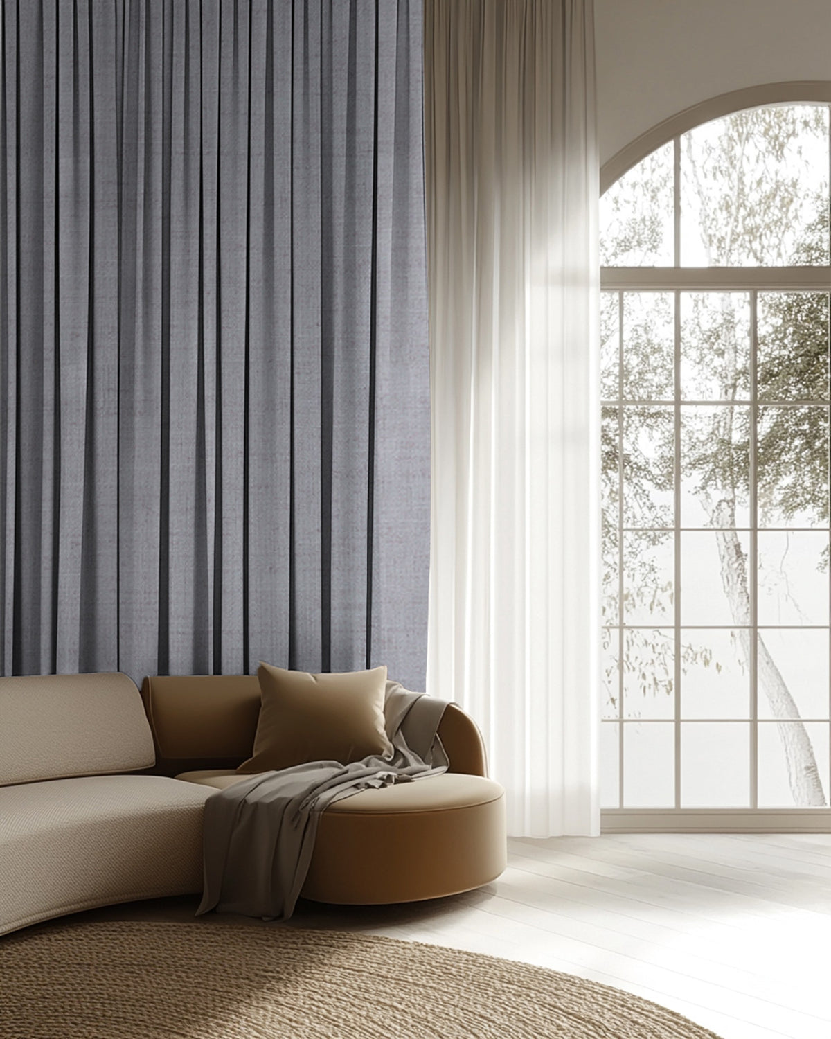 Sally Linen Blend custom drapery in gray paired with white sheer curtains over an arched window in a sophisticated living room.