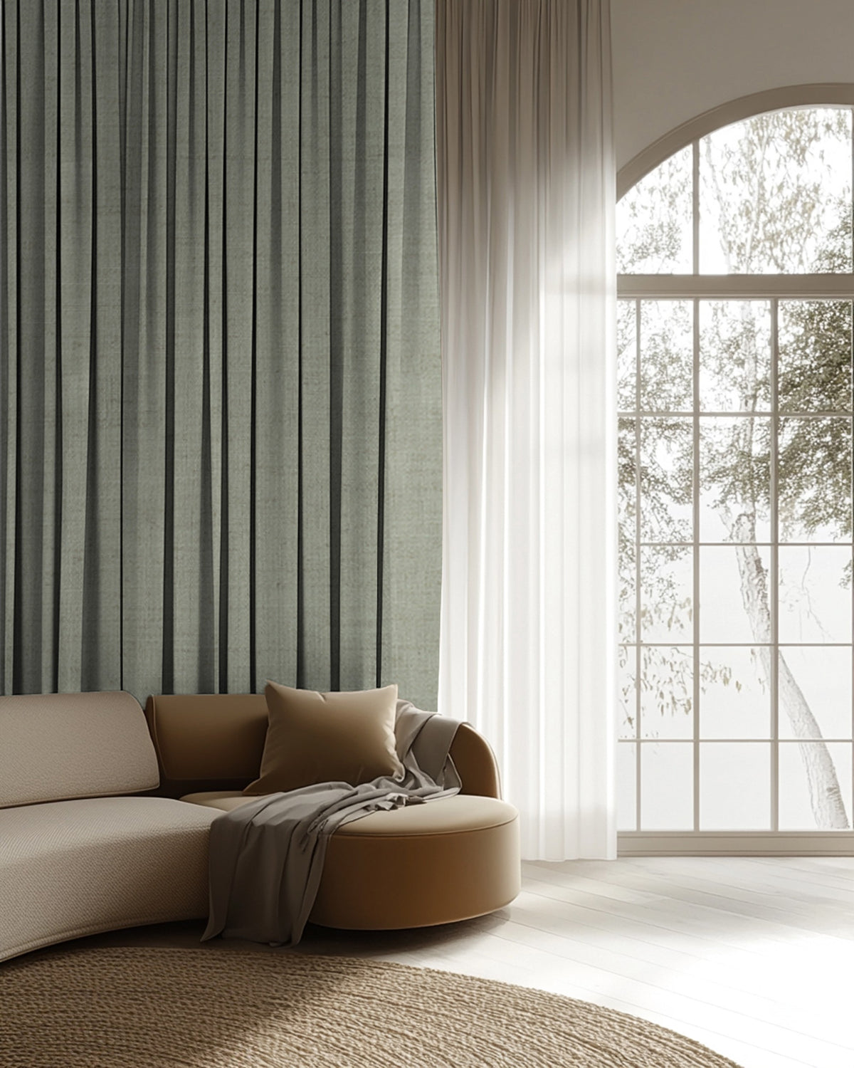 Sally Linen Blend custom curtain in muted green with sheer white drapery in a sophisticated living room, beside a modern curved sofa and arched window.
