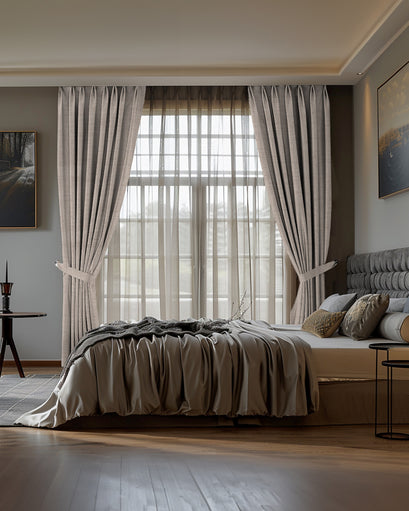 Sally Linen Blend custom pinch pleat drapes & sheer curtains tied back in a sophisticated bedroom for elegant light control.