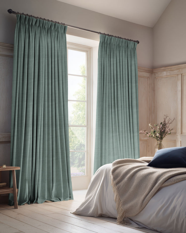 Teal linen blend 100% blackout custom curtains with elegant pinch pleat header, enhancing bedroom light control & privacy.