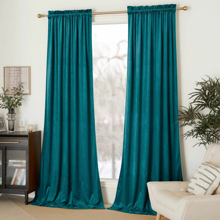 Elegant custom teal velvet drapery with gathered header for luxury window treatments & sophisticated home decor.