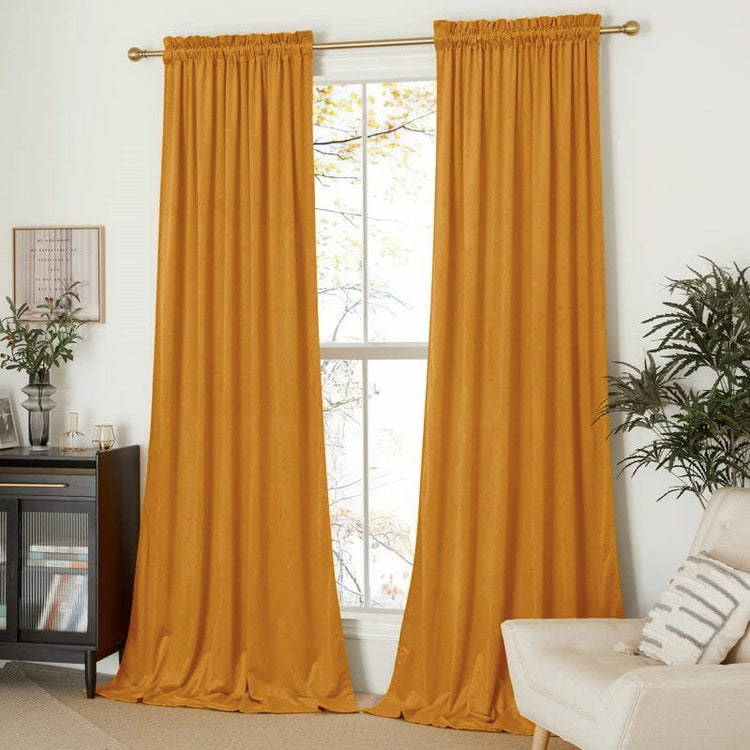 Classic custom gold velvet curtains with rod pocket header, framing a window, offering sophisticated privacy & light control.