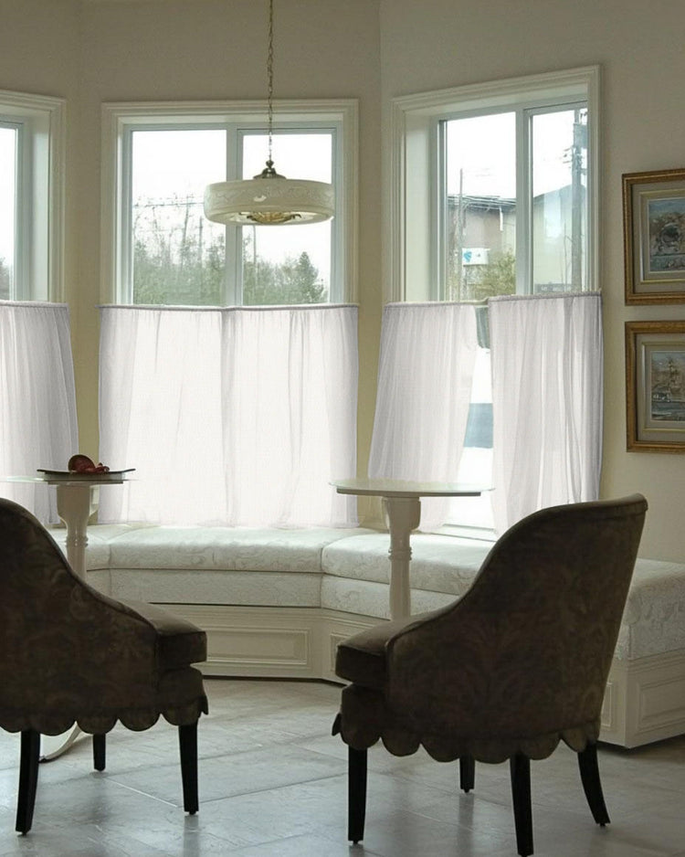 Elegant Wengen Linen & Cotton Blend Airy Sheer Custom Cafe Curtains on multiple bay windows, softly diffusing light & ensuring privacy.