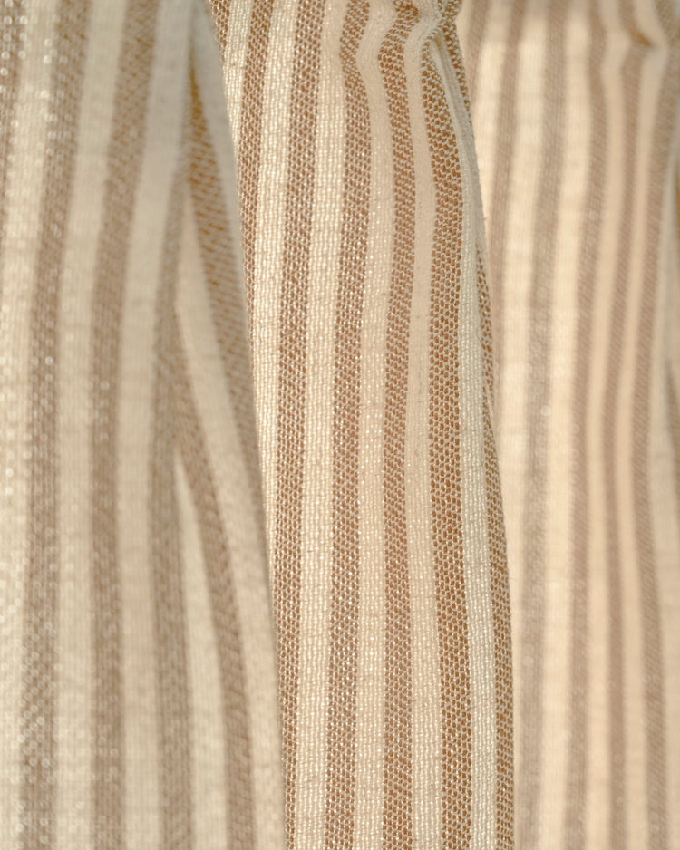 Detailed view of Milo linen blend striped cafe curtain fabric, showcasing textured natural cream and tan vertical stripes.