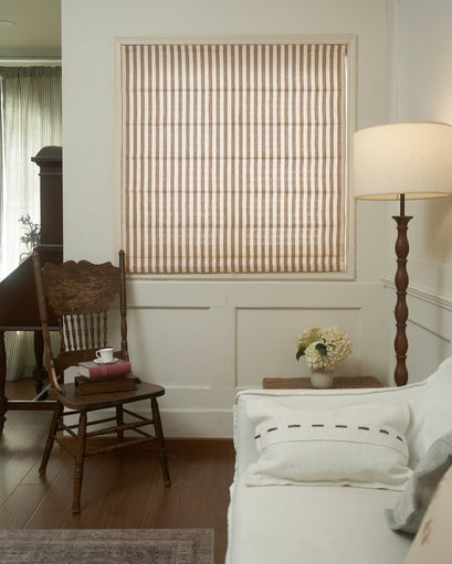 Milano Flat Fold Linen Blend Striped Custom Roman Shade in a cozy room, providing tailored light control & sophisticated home decor.