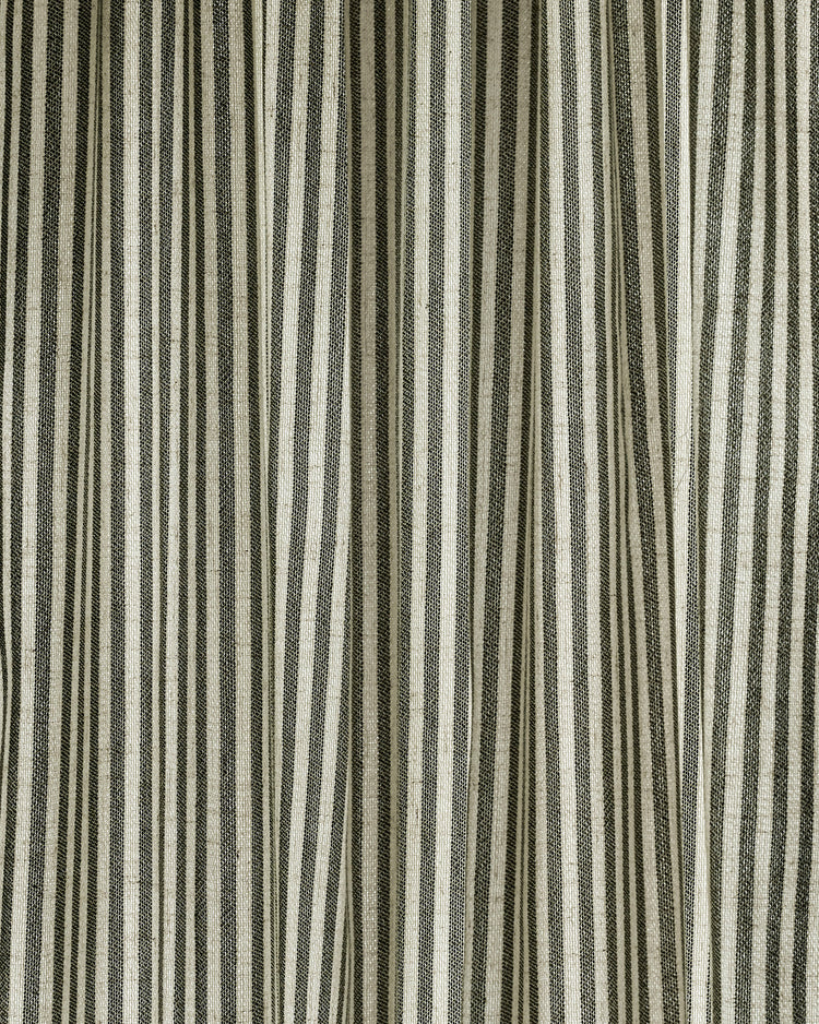 Milo custom linen blend curtain, featuring natural textured fabric with elegant vertical charcoal stripes and soft folds.