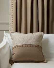 Two-tone Zane Wool Blend Throw Pillowcase with horizontal yarn stitching, complementing a beige custom drapery panel.