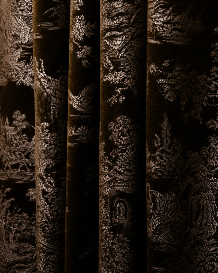 Deep brown custom velvet curtain with shimmering silver foil-printed Zen pattern, showcasing luxurious texture and elegant folds.