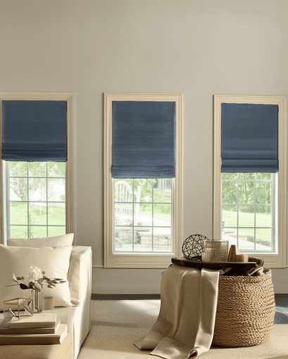 Elegant Zoe Flat Fold custom Roman shades in rich navy linen-look fabric on three windows, providing stylish light control.