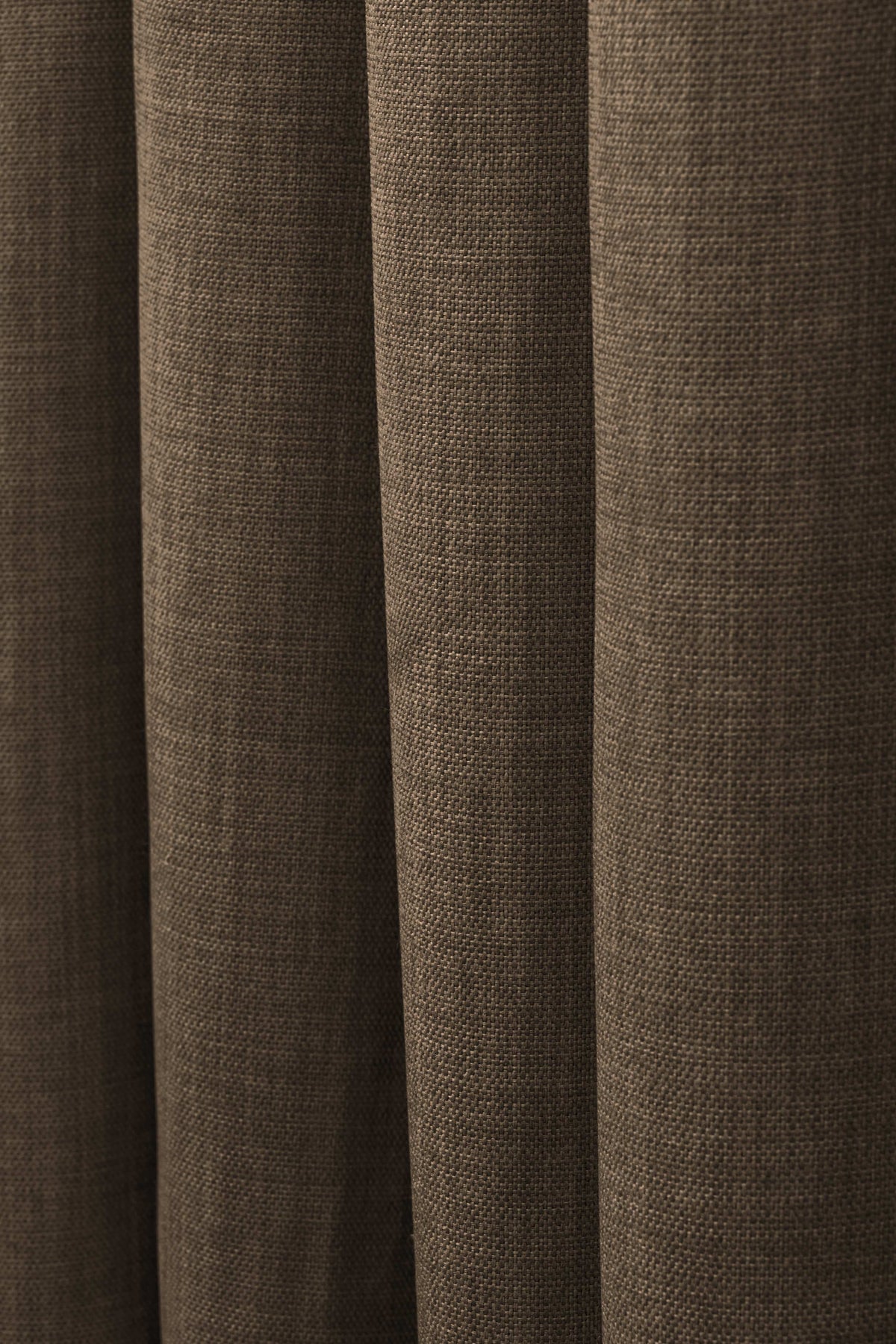 Close-up of Zoe Linen Look custom curtain in brown, highlighting its soft, textured pure linen fabric and elegant folds for window treatments.