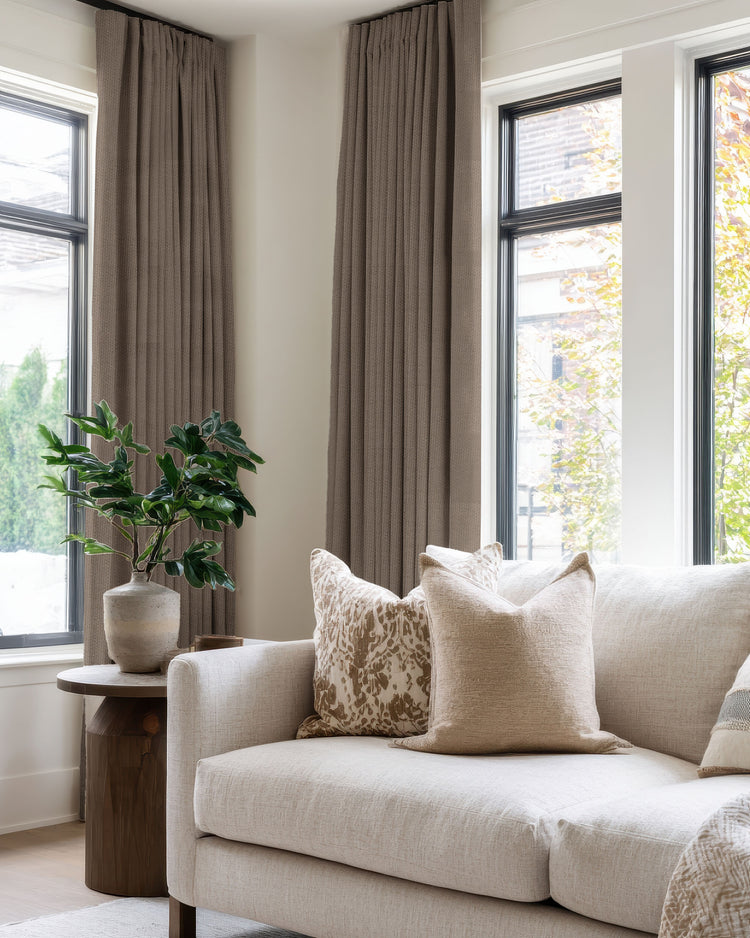 Custom Zoe 100% Blackout Linen Look Drapery in dark taupe for large windows, creating sophisticated light control in a modern living room.