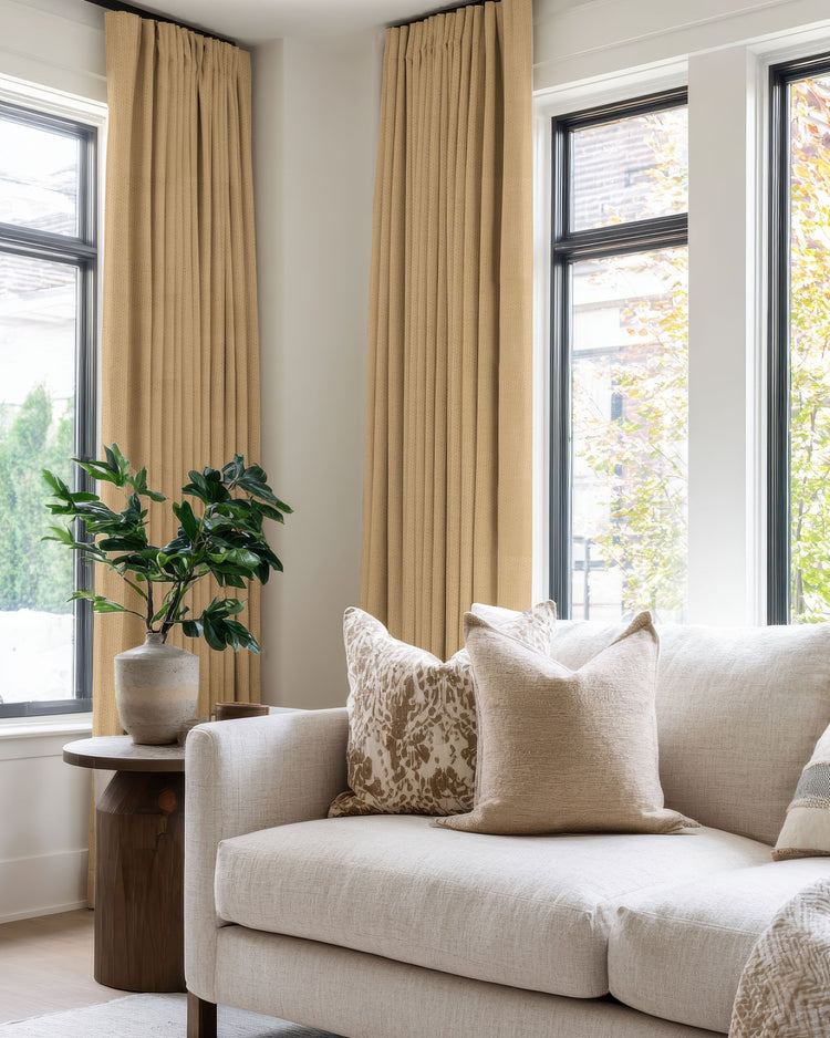 Zoe 100% blackout linen look custom curtains on large living room windows, providing elegant privacy and superior light control.